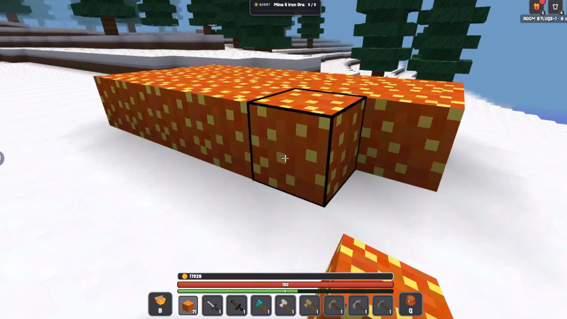 Kubz.io — mining a vein of copper ore blocks in a snow biome, with the health and hotbar HUD on screen.
