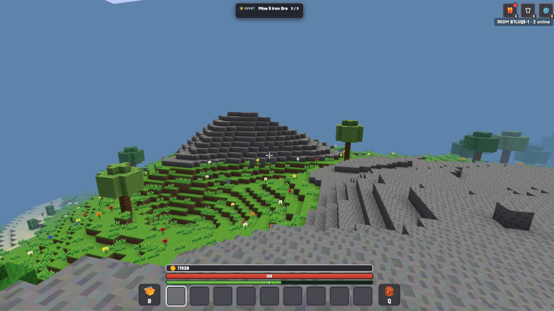 Kubz.io — a wide overview of the green voxel landscape with rolling hills and a mountain to explore.